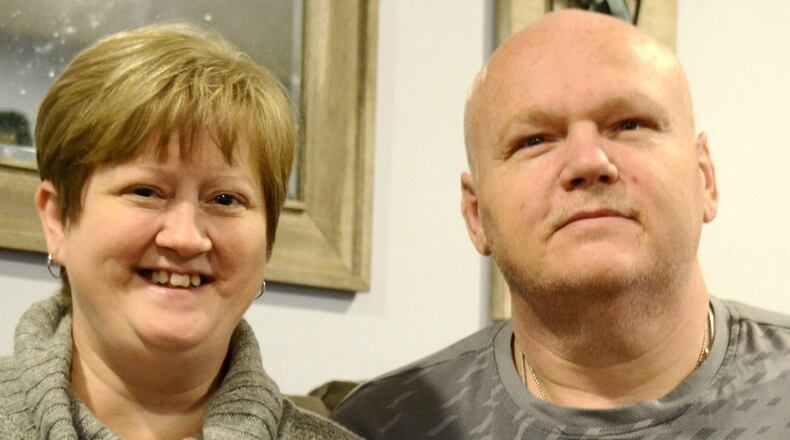 Keli Thorn, left, is in need of a new kidney, and her husband, Aaron, has been spreading the word about his wife’s need on social media and out around Butler County. Keli was diagnosed with polycystic kidney disease, a genetic kidney disease she had before her 2009 diagnosis. Pictured are Keli and Aaron in the Fairfield Twp. home on Dec. 31, 2019. MICHAEL D. PITMAN/STAFF