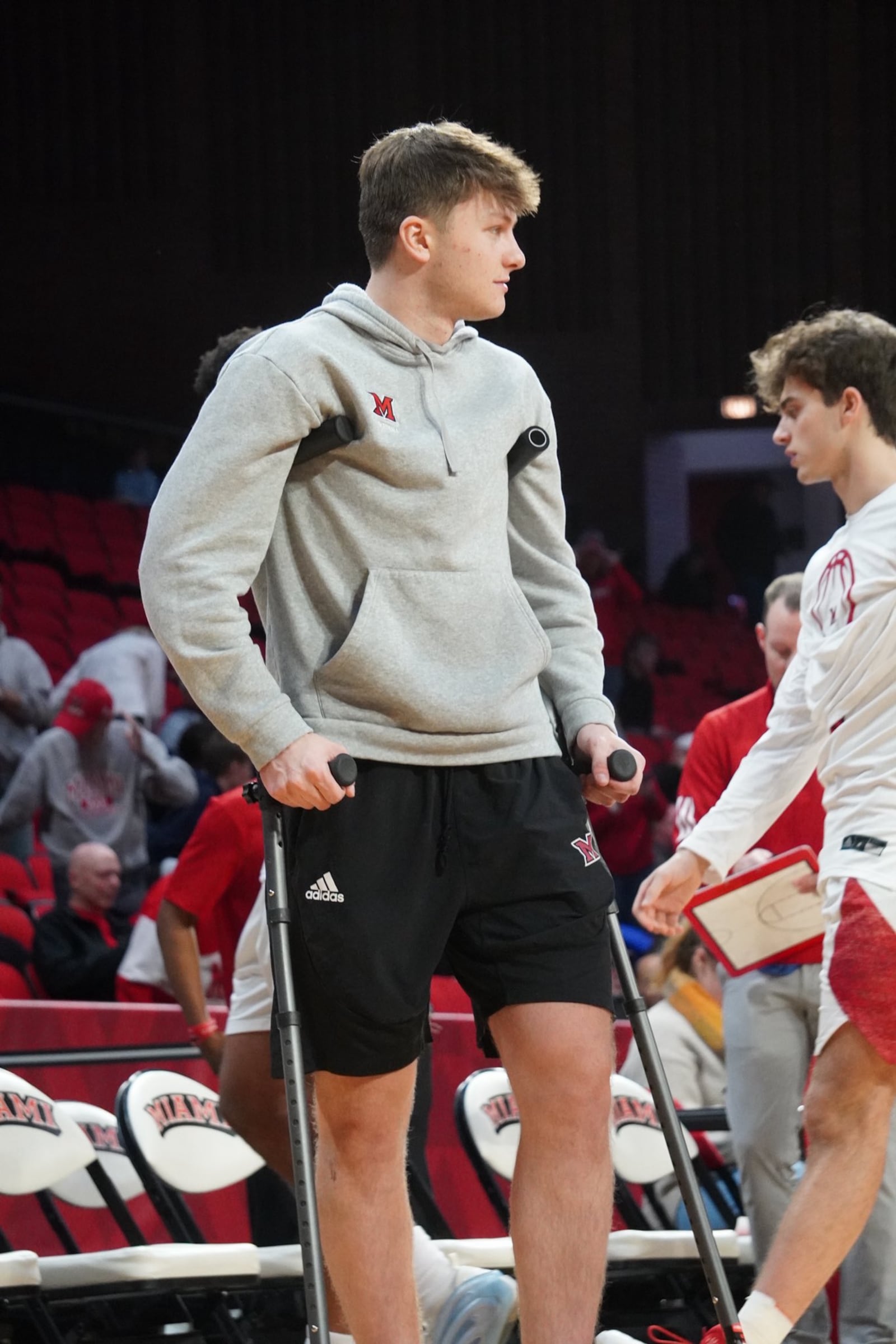 Evan Ipsaro watches on before Miami's game against Milligan earlier this season. Ipsaro suffered a season-ending injury against Ball State during the RedHawks' 2025-26 season. CHRIS VOGT / CONTRIBUTED