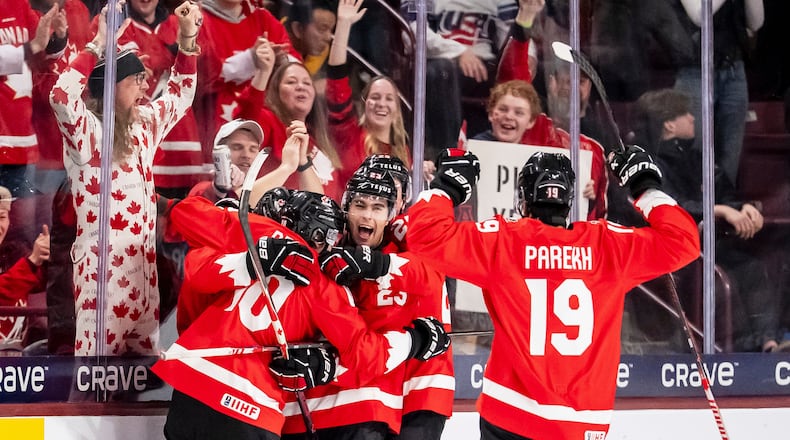 Canada's Cole Beaudoin (26) celebrates his goal with teammates after scoring in second period IIHF World Junior Championship hockey action against Finland in Minneapolis on Wednesday, Dec. 31, 2025. (Christopher Katsarov/The Canadian Press via AP)