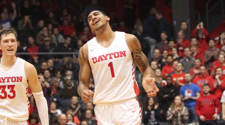 Dayton’s Ryan Mikesell, left, and Obi Toppin react after a dunk by Toppin in the final seconds of the first half against Georgia Southern on Saturday, Dec. 29, 2018, at UD Arena. David Jablonski/Staff