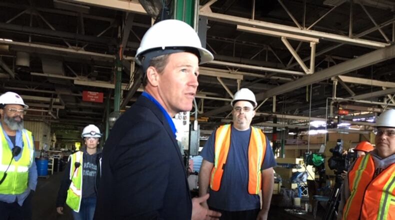 Ohio Lt. Gov. Jon Husted speaking with Dayton Phoenix Group workers Friday. THOMAS GNAU/STAFF