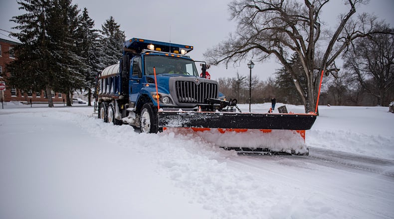A plow operator from the 88th Civil Engineer Squadron clears the roads of snow Feb. 4 2022 on Wright-Patterson Air Force Base. U.S. AIR FORCE PHOTO/SENIOR AIRMAN JACK GARDNER