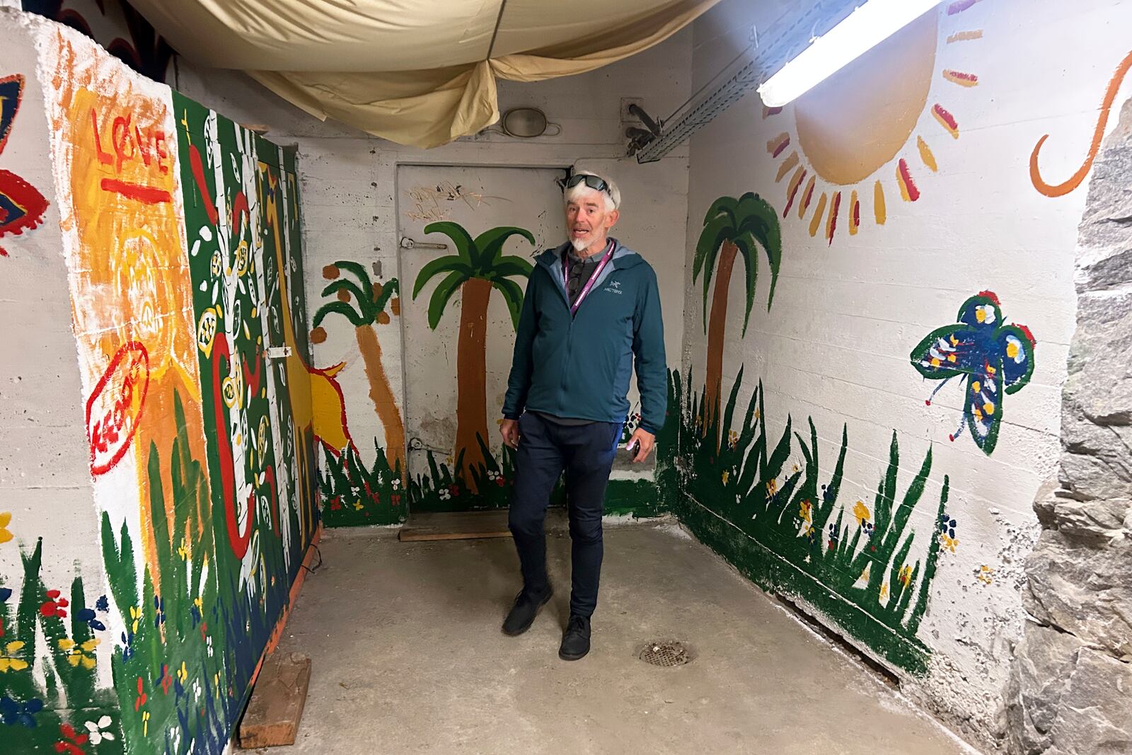 Odd John Resser, Emergency Planning Officer for the municipality, walks in an underground shelter which was previously used by a youth club, in Kongsberg, Norway Thursday, May 8, 2025. (AP Photo/Emma Burrows)