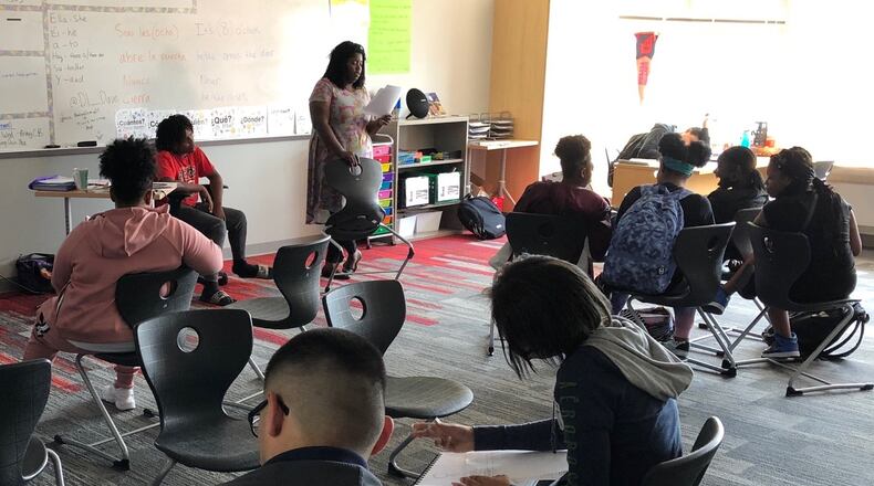 Dayton Early College Academy teacher Maria Ogletree works with her freshman advisory students on questions related to having a growth mindset, Monday, Sept. 16, 2019. DECA was the highest-scoring local charter school on the Ohio Department of Education’s annual school report card. JEREMY P. KELLEY / STAFF