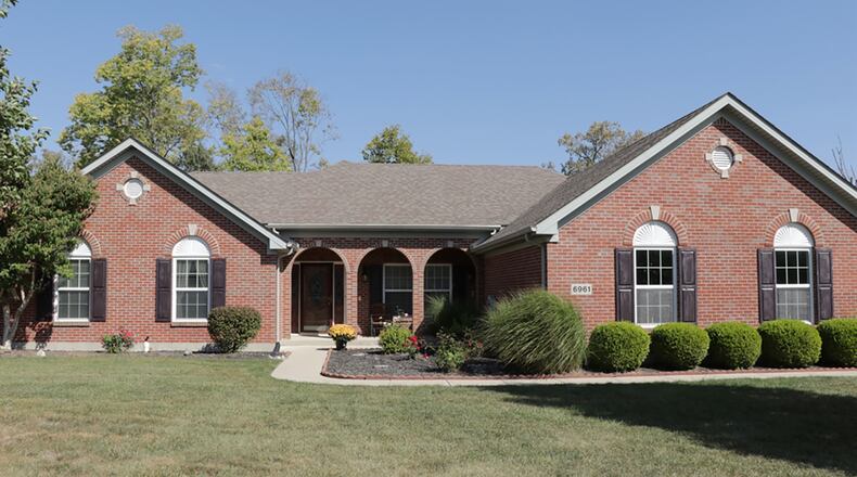 The brick house has about 2,350 sq. ft. of living space within its open split floor plan design. 
Extensive concrete work creates an extra parking pad, walkways, steps and covered patios and porches. CONTRIBUTED PHOTO BY KATHY TYLER