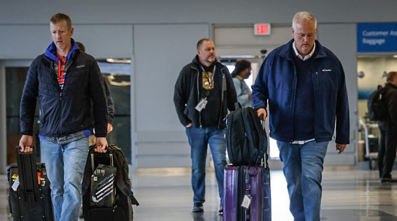 Travelers make their way through Dayton International Airport terminal Friday, Nov. 22, 2024. According to AAA, more people are flying this year for Thanksgiving weekend, 5.84 million of them nationwide, a 2% increase compared to last year and a nearly 11% increase over 2019. JIM NOELKER/STAFF