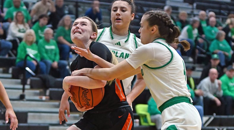 Waynesville's Katie Berrey is fouled by Proctorville Fairland's Rylee Russell during their Division V regional semifinal game on Wednesday, March 4, 2026 at Lakota East. The Dragons won 76-38. JEFF GILBERT / CONTRIBUTED PHOTO