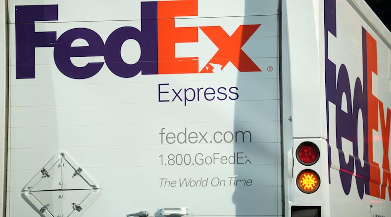 FILE - The company logo is shown on a FedEx delivery van, Sept. 13, 2023, in downtown Denver. (AP Photo/David Zalubowski, File)
