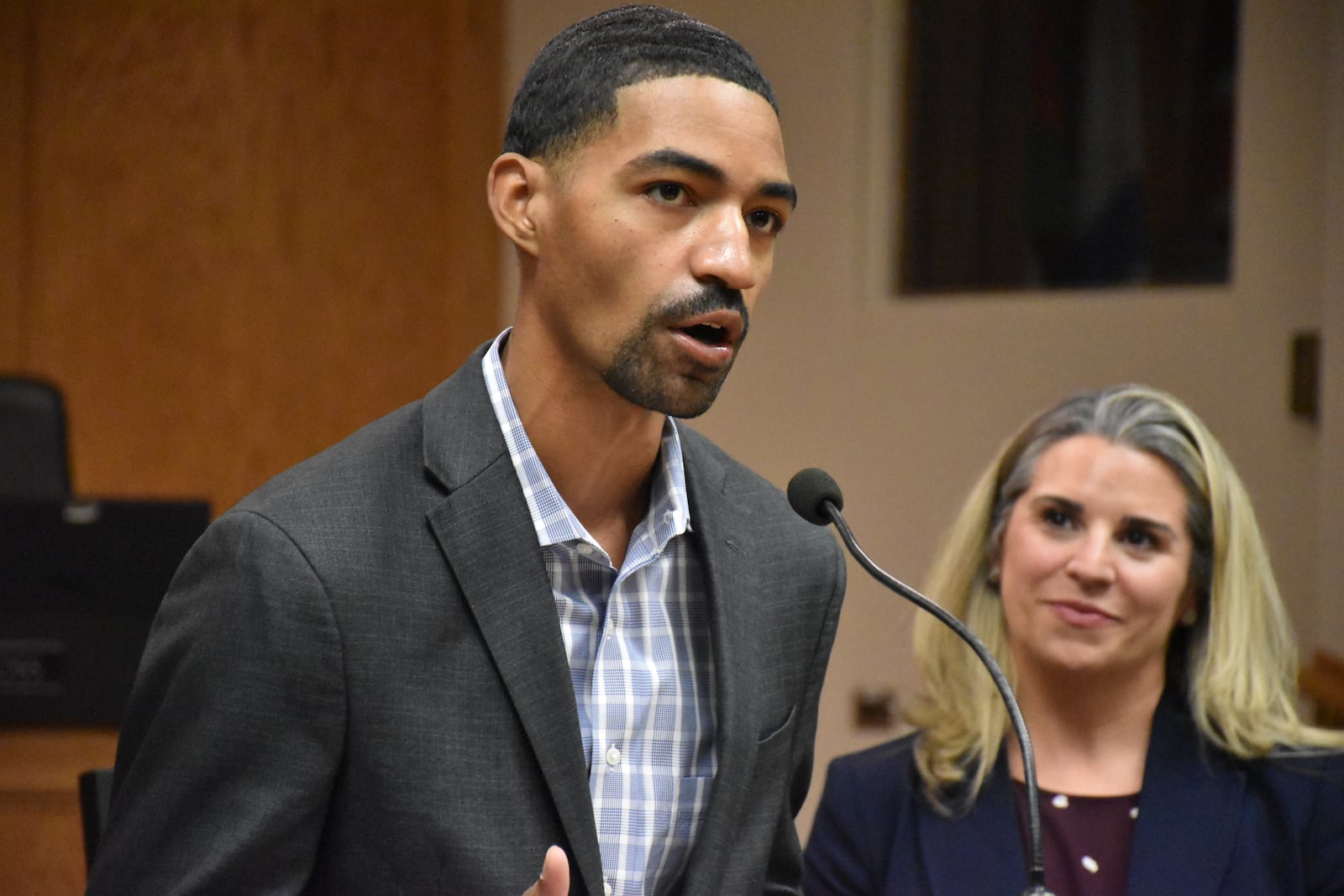 Quinones Corniel, associate director of strategic partnerships with Cure Violence Global, speaks at City Hall about Dayton's proposed violence interruption program on Sept. 24, 2025. Other speakers included Sarah Hackenbracht, president and CEO of the Greater Dayton Area Hospital Association. CORNELIUS FROLIK / STAFF