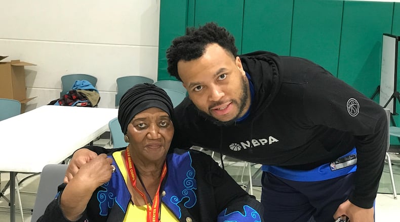 Mozelle Garcia, the longtime Dayton Public Schools teacher and now director of educational services at Corinthian Baptist church a site manager for the Dayton Scholars summer program, gets an embrace from Daequan Cook. Tom Archdeacon/CONTRIBUTED