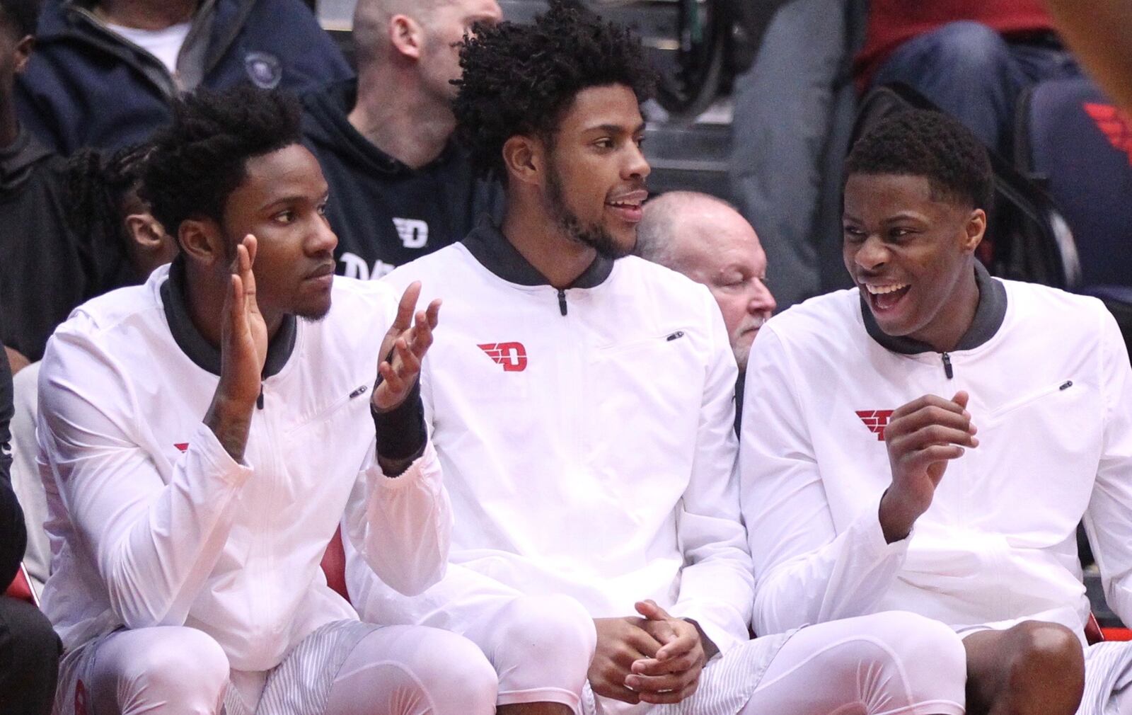 Dayton’s John Crosby, Xeyrius Williams and Kostas Antetokounmpo watch a game against Fordham from the bench on Saturday, Feb. 17, 2018, at UD Arena. David Jablonski/Staff