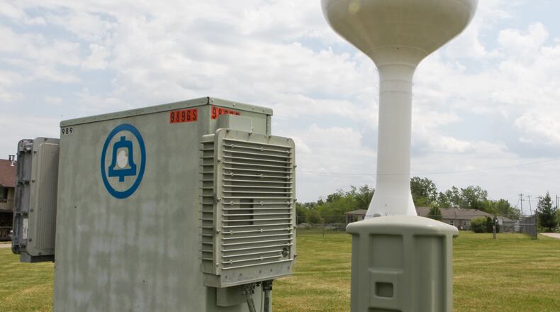 A Cincinnati Bell cell tower atop the water tower on Eaton Road. Staff photo by Greg Lynch