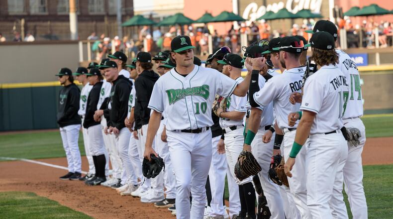 The Dayton Dragons played their home opener on Tuesday, Apr. 11, 2023 at Day Air Ballpark in downtown Dayton to a sellout crowd of 8,135, extending the team’s streak to 1,442 games, an all-time record for professional sports franchises. The Dragons lost to the Great Lakes Loons 9-7. Did we spot you there? TOM GILLIAM/CONTRIBUTING PHOTOGRAPHER
