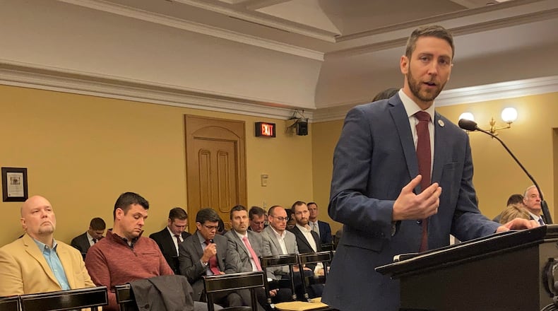 Rep. Riordan McClain, a Sandusky Republican, answers a question about "backpack" legislation he is sponsoring in the Ohio House that would expand the school voucher program to any student in the state, on Tuesday, Feb. 15, 2022, in Columbus, Ohio. McClain called the bill a "kids first" approach to school funding. (AP Photo/Andrew Welsh-Huggins)