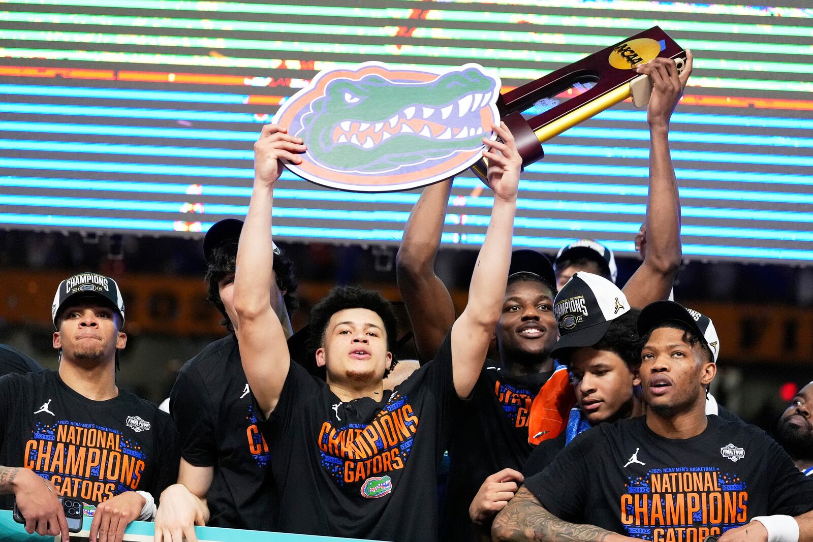 Florida celebrates with the trophy after their win against the Houston in the national championship at the Final Four of the NCAA college basketball tournament, Monday, April 7, 2025, in San Antonio. (AP Photo/Brynn Anderson)