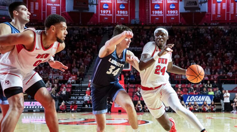 Western Kentucky forward Tyrone Marshall Jr. (24) moves around Liberty forward Ben Southerland (34) during an NCAA college basketball game in Bowling Green, Ky., Saturday, Jan. 6, 2024. (Grace Ramey/Daily News via AP)