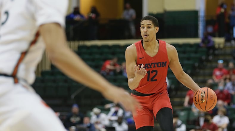 Dayton's Zimi Nwokeji dribbles against Miami in the first round of the ESPN Events Invitational on Thursday, Nov. 25, 2021, at the HP Fieldhouse in Kissimmee, Fla. David Jablonski/Staff