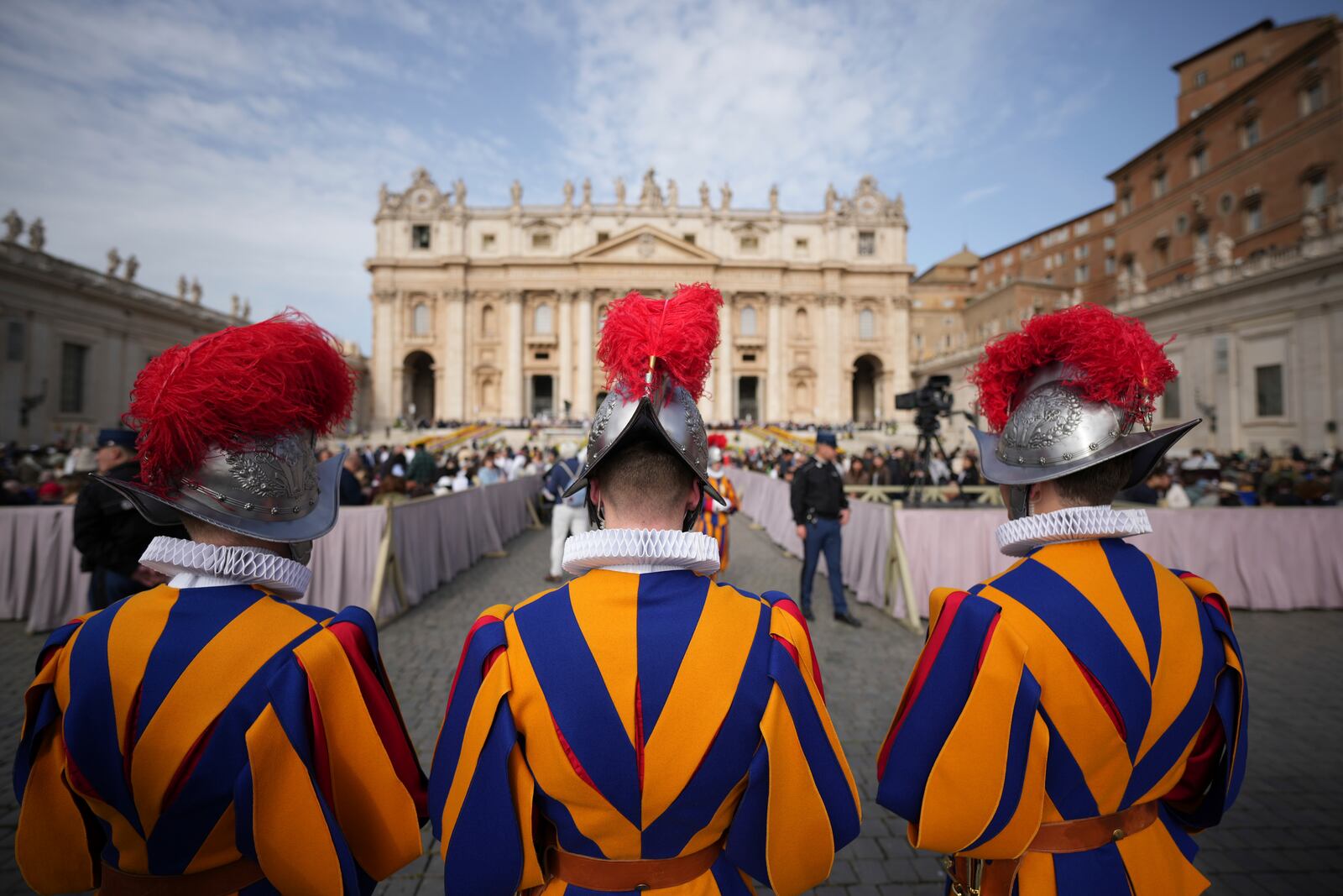 Pontifical Swiss guards wait for the start of the Easter mass in St. Peter's Square at the Vatican Sunday, April 20, 2025. (AP Photo/Andrew Medichini)