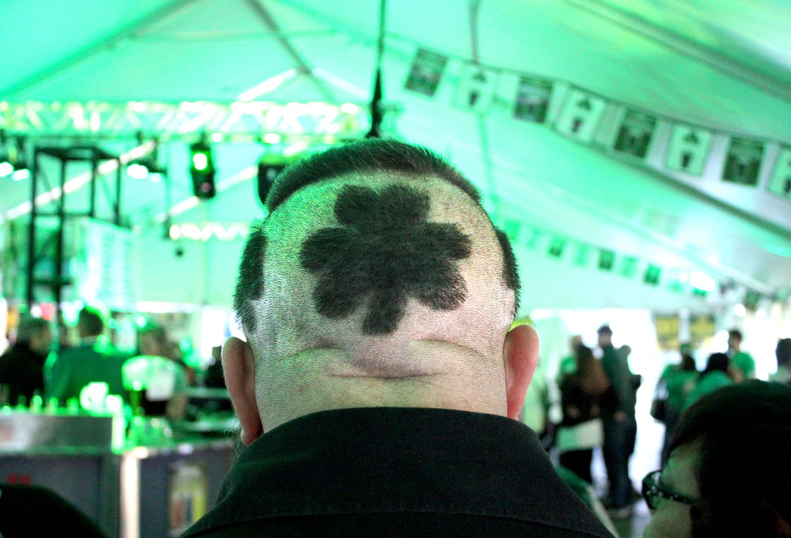 A man at the Dublin Pub in Dayton shaved a shamrock onto the back of his head to commemorate the day. Beer, Irish whiskey and breakfast were on the menu at the pub as revelers celebrated St. Patricks Day. MARK FISHER / STAFF