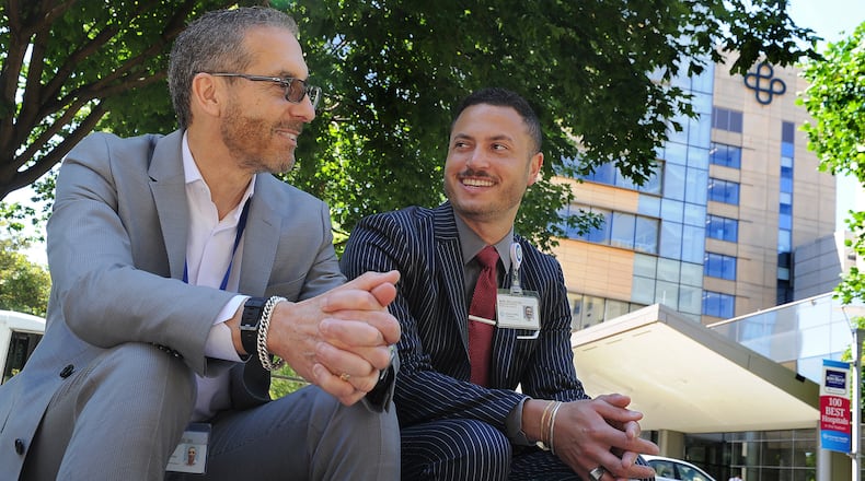Dr. Marc Belcastro, Premier Chief Medical Officer, left, and his son, Marc II, who is a Premier Advanced Practice Recruiter, talk about why this Father's Day is extra special this year. MARSHALL GORBY\STAFF
