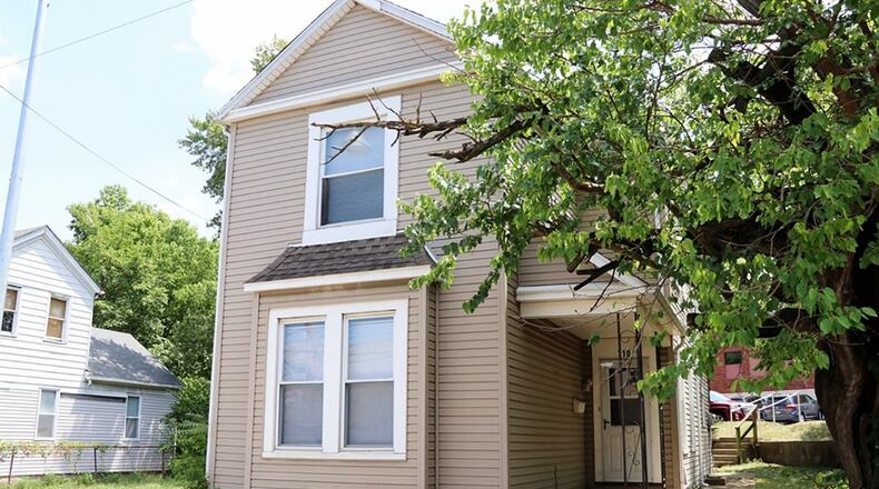 The 2-story home sits on an irregular lot with trees and lawn space. Updates include flooring throughout and fresh interior paint. Windows, siding and roof have been updated. CONTRIBUTED PHOTOS BY KATHY TYLER