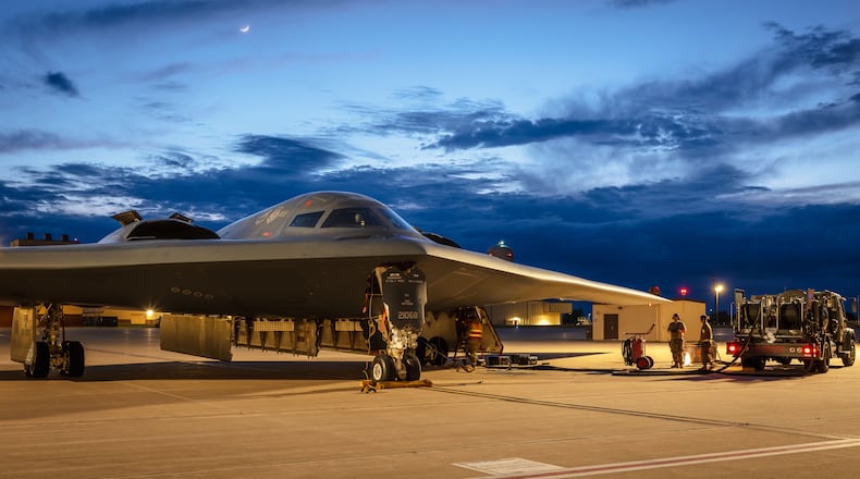 U.S. Airmen assigned to the 509th Logistics Readiness Squadron and 393rd Bomber Generation Squadron conduct hot-pit refueling for a B-2 Spirit at Whiteman Air Force Base, Missouri, May 28, 2025. The 509th Bomb Wing and its fleet of B-2s serve as part of the U.S. Air Force's conventional and strategic combat force with the capability to project U.S. airpower anywhere around the world. (U.S. Air Force photo by Staff Sgt. Joshua Hastings)