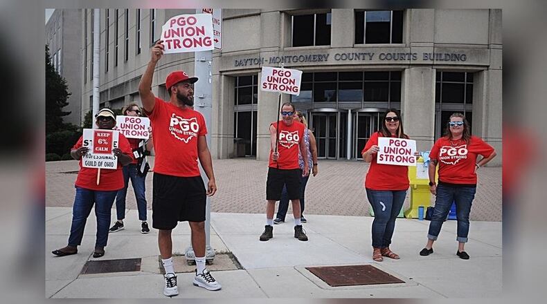 Members of the Professionals Guild of Ohio, the union that represents Montgomery County Children Services workers, protested Friday, Sept. 6, 2019, outside the Dayton and Montgomery County courts building. WAYNE BAKER/STAFF