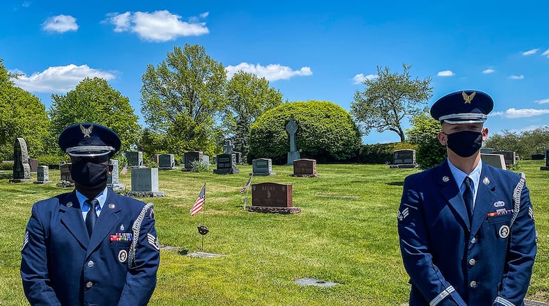 Wright-Patterson Air Force Base Honor Guard members Staff Sgt. Sean Chapman (left) and Senior Airman Rodney Petrie honor the life of Hilton Carter, a Tuskegee Airman, May 13 at St. Joseph Cemetery just south of Columbus along Ohio 23, not far from Rickenbacker Airport, Columbus. (Contributed photo)