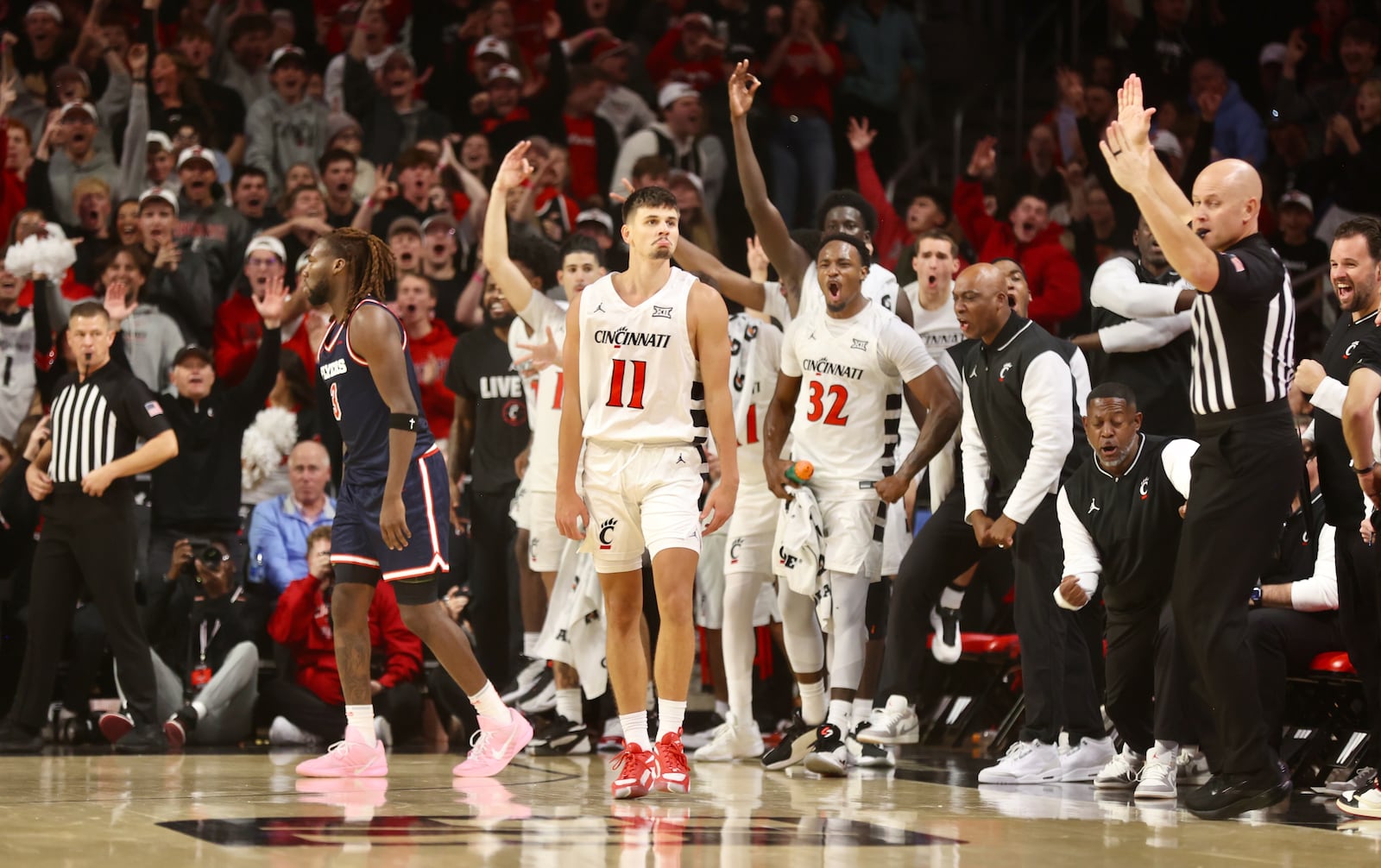 Cincinnati's Kerr Kriisa reacts after making a 3-pointer against Dayton on Tuesday, Nov. 11, 2025, at Fifth Third Arena in Cincinnati. David Jablonski/Staff