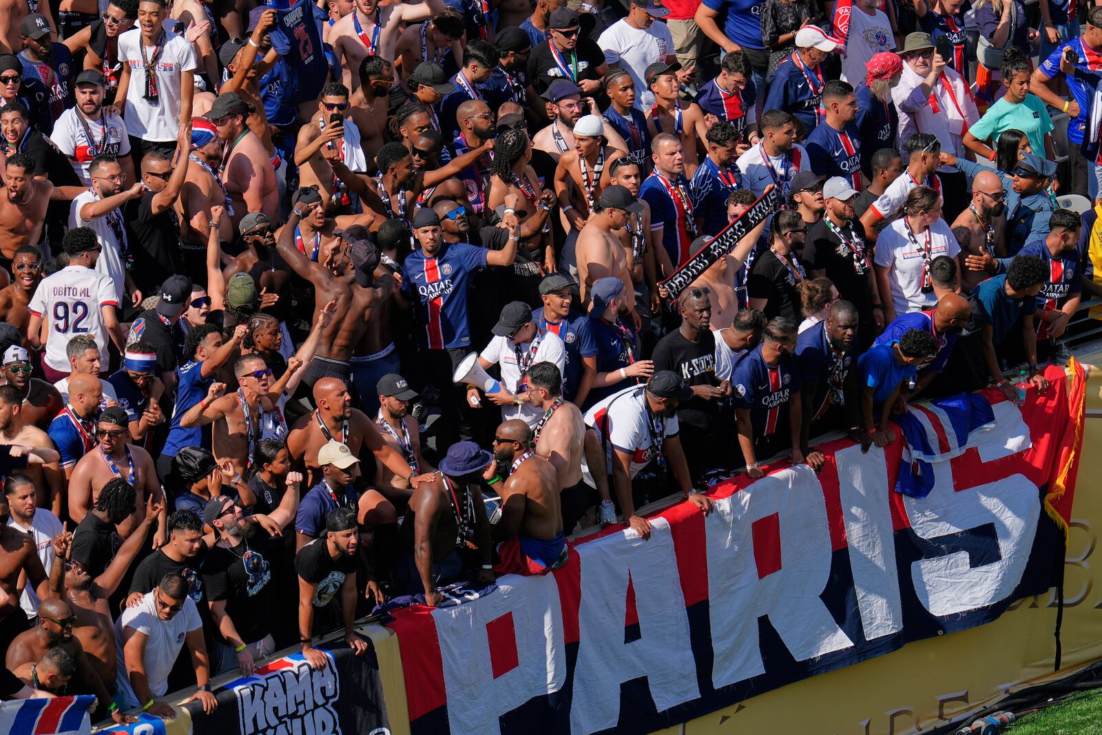 Paris Saint-Germain fans cheer during the Club World Cup semifinal soccer match between PSG and Real Madrid in East Rutherford, N.J., Wednesday, July 9, 2025. (AP Photo/Pamela Smith)