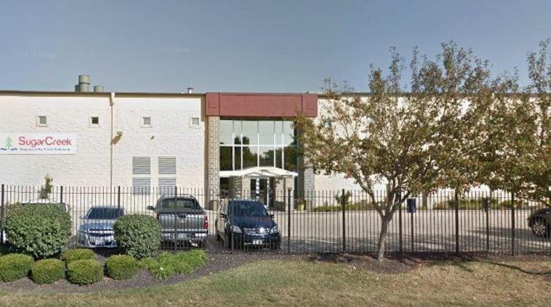 An entrance to Sugar Creek Packing’s Dayton plant off Beerman Avenue. THOMAS GNAU/STAFF