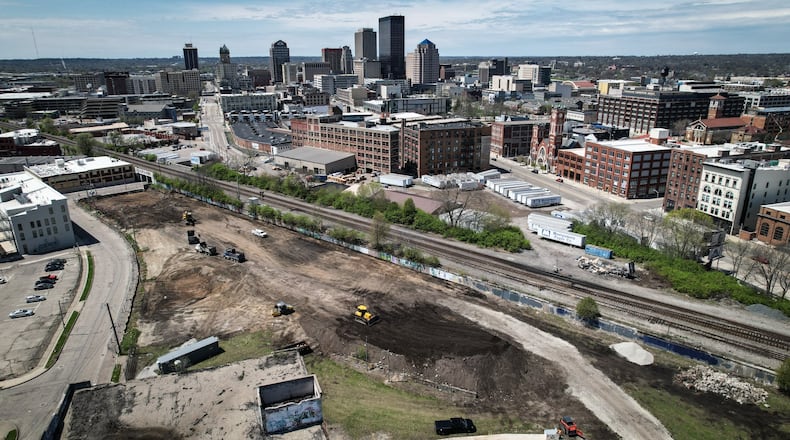 After delays, new apartments buildings in downtown Dayton are now taking shape like this one at East Fourth St. and Wayne Ave. JIM NOELKER/STAFF
