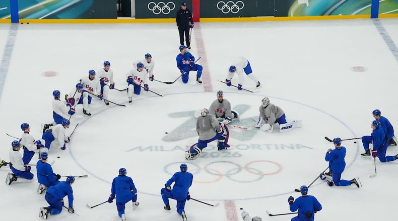The United States men's ice hockey team gathers on the ice during practice at the 2026 Winter Olympics, in Milan, Italy, Sunday, Feb. 8, 2026. (AP Photo/Carolyn Kaster)