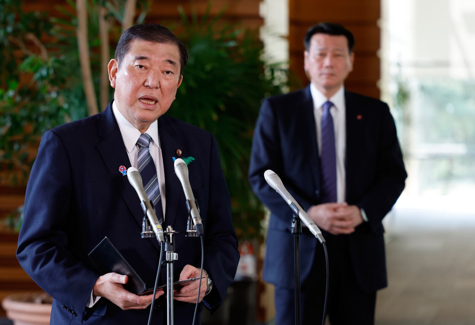 Japanese Prime Minister Shigeru Ishiba speaks to reporters reacting after a Japanese negotiator held ministerial talks at the White House regarding U.S. tariffs, at the prime minister's office in Tokyo, Japan, Thursday, April 17, 2025. (Franck Robichon/Pool Photo via AP)