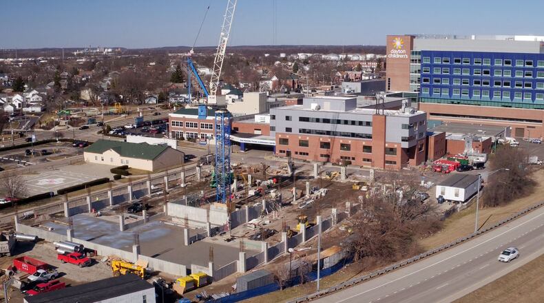 Groups applied for Dayton commercial building permits valued at $284 million in 2018, another giant year for development. Dayton Children’s is building a 600-space, four-story employee parking garage on the southwest portion of the main campus, bordered by the hospital, Grant Street and Ohio 4. TY GREENLEES / STAFF