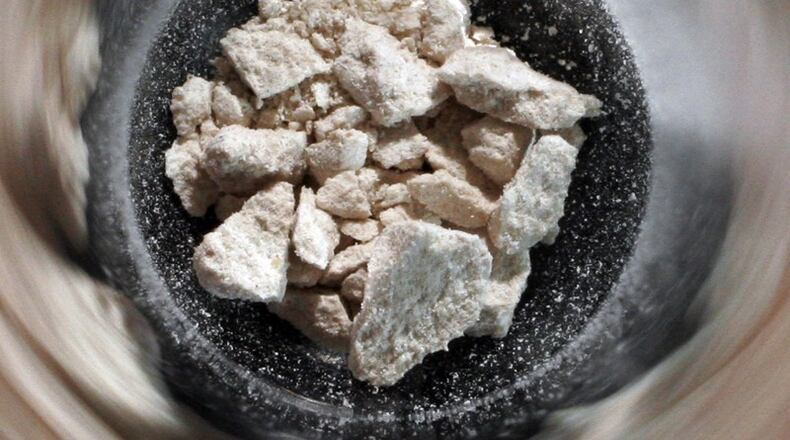 Heroin is seen at the bottom of a test tube at the Montgomery County Crime Lab. STAFF PHOTO / CHRIS STEWART(Staff Writer)