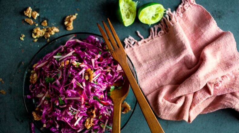 Asian red cabbage and walnut salad, in New York, Sept. 26, 2015. A dressing that includes both agave syrup and fish sauce provides a blend of sweet, salty and savory flavors.