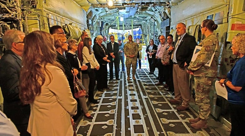 Ben Stuart, center right, 560th Aircraft Maintenance Squadron director, gives a briefing to members of the Air Force Materiel Command Civic Leader Program inside a C-130 aircraft cargo area at Robins Air Force Base, Georgia, Oct. 22, 2024. Air Force photo by Joseph Mather
