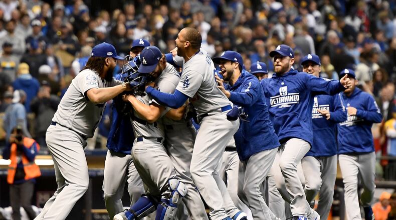 MILWAUKEE, WI - OCTOBER 20: The Los Angeles Dodgers celebrate after defeating the Milwaukee Brewers in Game Seven to win the National League Championship Series at Miller Park on October 20, 2018 in Milwaukee, Wisconsin. (Photo by Stacy Revere/Getty Images)