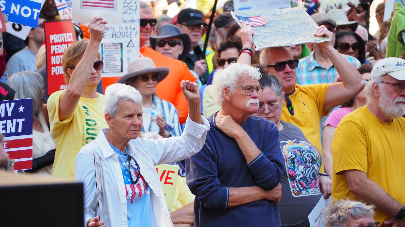 Following speakers, songs and chants, attendees took to the streets Saturday, Oct. 18, 2025 in downtown Dayton, marching around city blocks as part of a "No Kings" Protest. BRYN DIPPOLD/STAFF