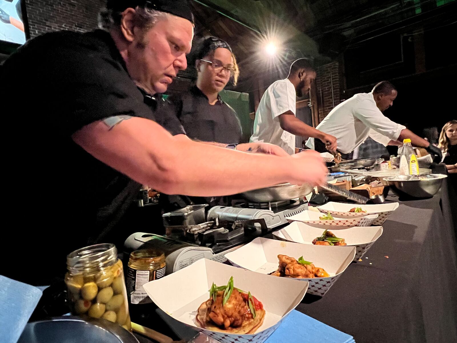 The final round of the Diced in Dayton Chef's Challenge saw the team from Corner Kitchen led by executive chef Gavin St. Denis (far left), face off agains the team from Rich Taste Catering led by chef and owner Gerald Richardson (far right).