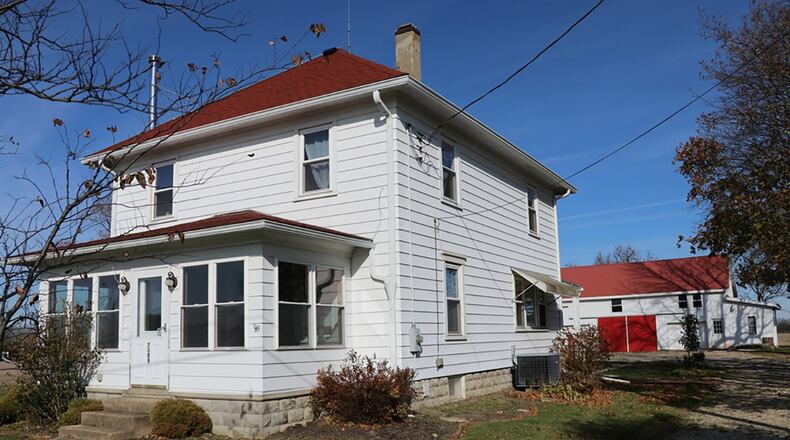 The 1.15-acre property includes the 2-story renovated farmhouse; a 1-car detached garage, a workshop out-building with covered front porch and a 86-by-56-foot barn with overhead doors, electric service, water, loft storage and concrete floors. CONTRIBUTED PHOTOS BY KATHY TYLER