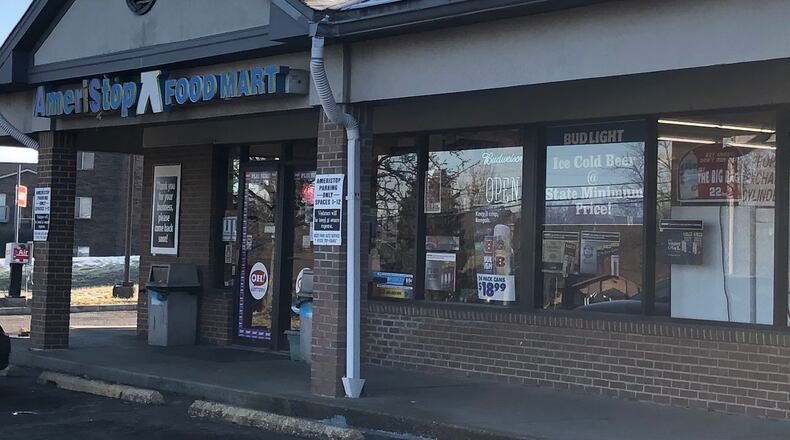 This Ameristop on Woodridge Boulevard was robbed Saturday and a clerk was shot in the arm, according to Fairfield police and a store employee. RICK McCRABB/STAFF