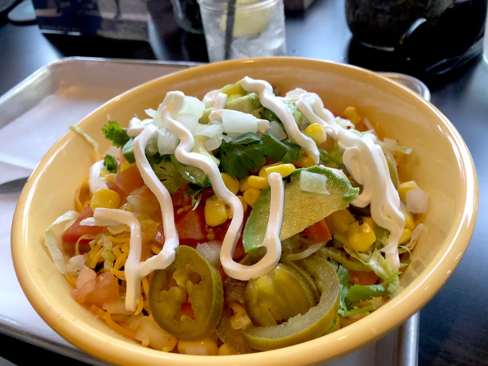 Latin Arepas is located with in Bar Granada on Monument Avenue on Dayton. A rice bowl is pictured.