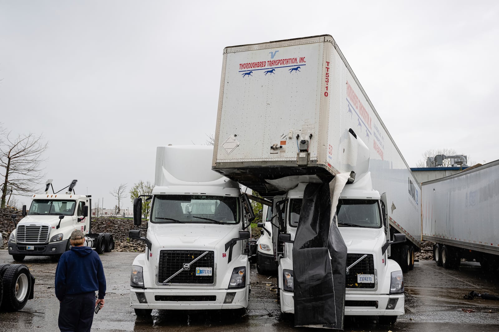 A trailer sits on top of a semi truck parked at J & J Transportation on Thursday, April 3, 2025, in Jeffersontown, Ky. (AP Photo/Jon Cherry)