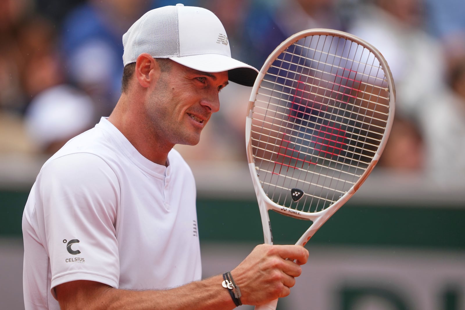 Tommy Paul of the U.S. reacts as he plays Denmark's Elmer Moller during their first round match of the French Tennis Open at the Roland Garros stadium, in Paris, Sunday May 25, 2025. (AP Photo/Lindsey Wasson)