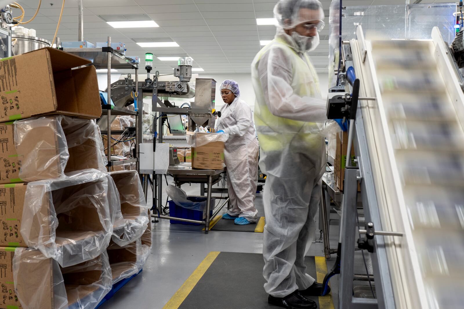 Workers load boxes of Plumpy'Nut, a nutritional lifesaving peanut paste sent to malnourished children worldwide, at Edesia Nutrition, Friday, March 14, 2025, in North Kingstown, R.I. (AP Photo/David Goldman)