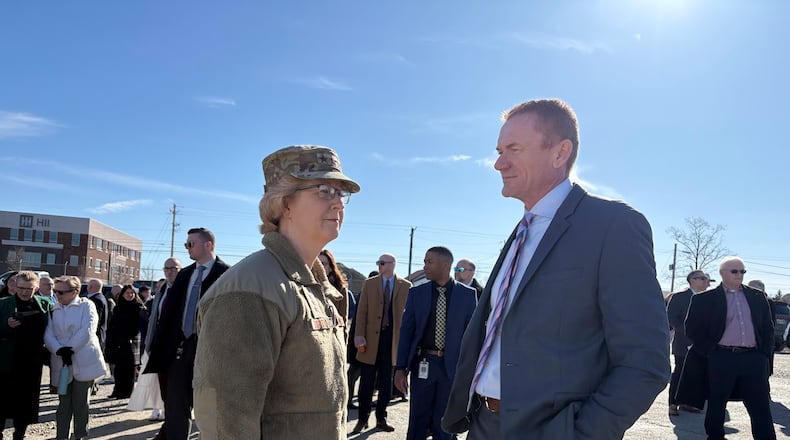 Lt. Gen. Donna Shipton, commander of the Air Force Life Cycle Management Center at Wright-Patterson Air Force Base, speaks with Jerad Barnett, president and chief executive of Synergy and Mills Development, on Thursday March 12, 2026. Synergy broke ground Thursday for its "Stratos" developments on Wright-Patterson. THOMAS GNAU/STAFF WRITER