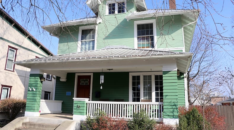 Renovations made to this historic Florschinger Haus, built around 1900, include an updated Shaker-style kitchen, updated full bathrooms, refinished hardwood flooring and woodwork. The house is located in downtown Germantown and has an inviting front porch, fenced back yard and a 2-car detached garage with alley access. CONTRIBUTED PHOTO BY KATHY TYLER