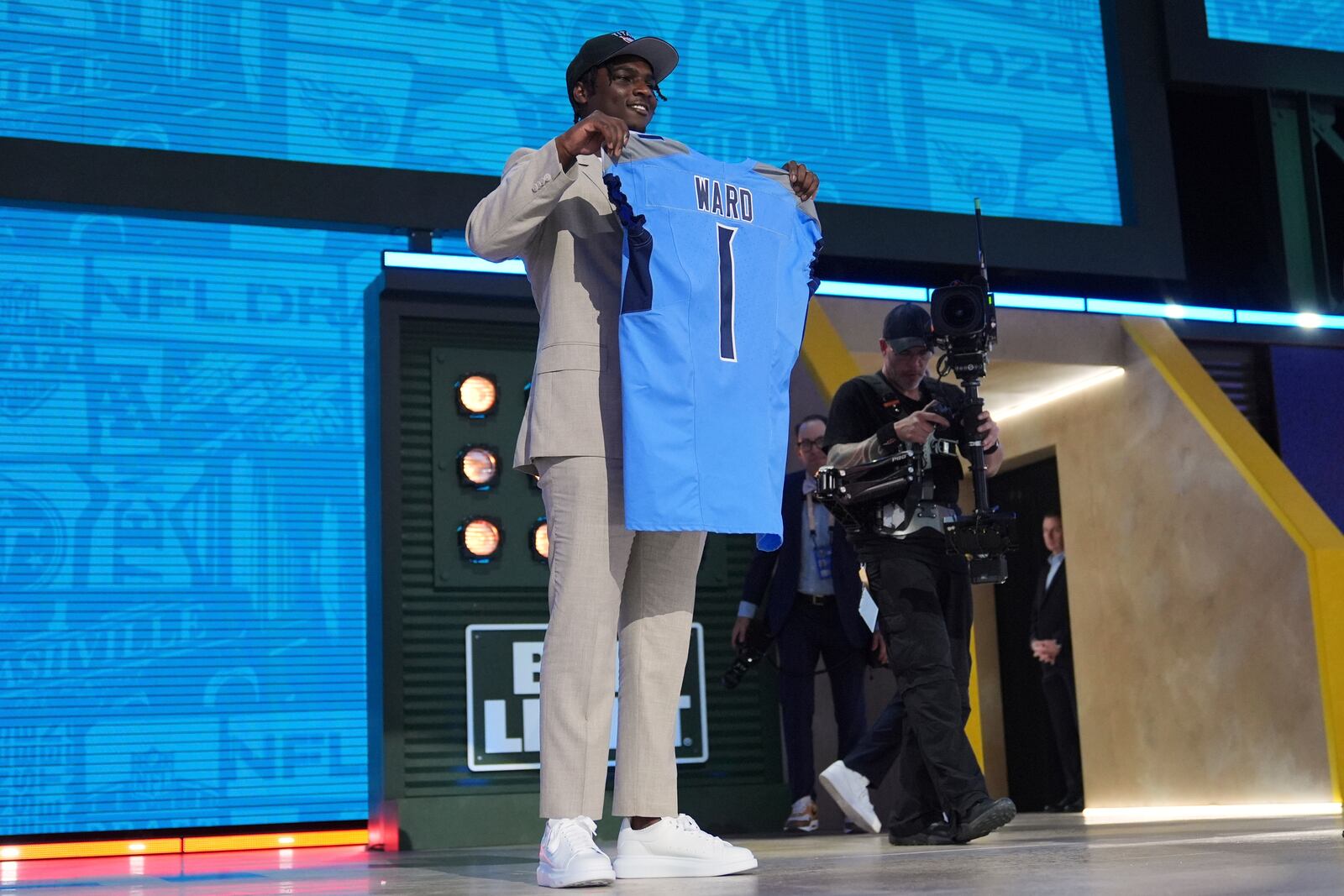 Miami quarterback Cam Ward poses after being chosen by the Tennessee Titans with the first overall pick during the first round of the NFL football draft, Thursday, April 24, 2025, in Green Bay, Wis. (AP Photo/Jeff Roberson)